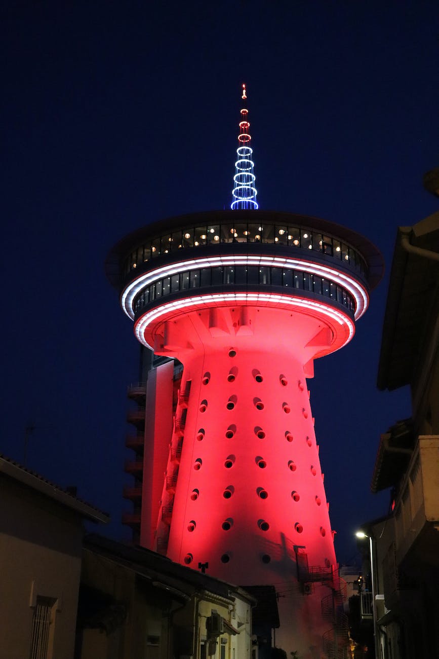 red and white tower during night time