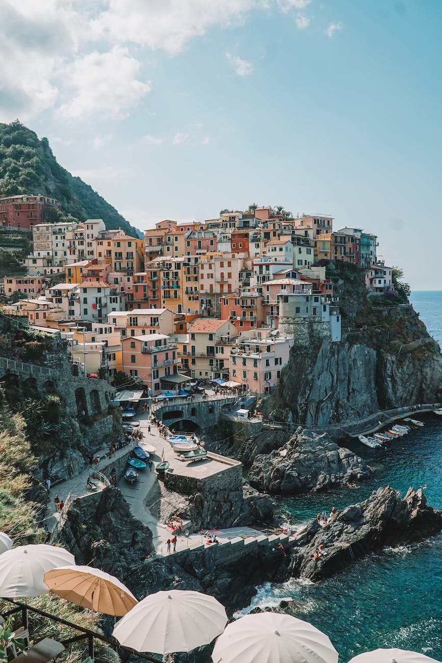 houses on a cliff in manarola italy