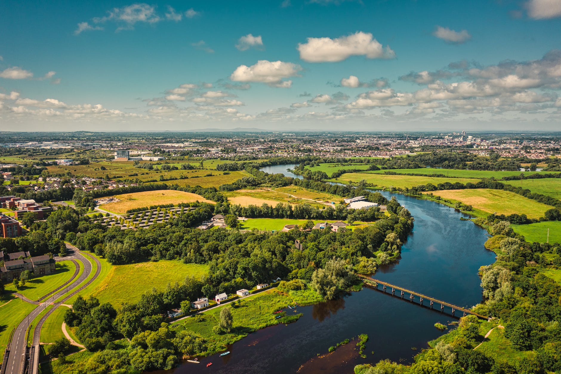 aerial photography of a river shannon surrounded by green field